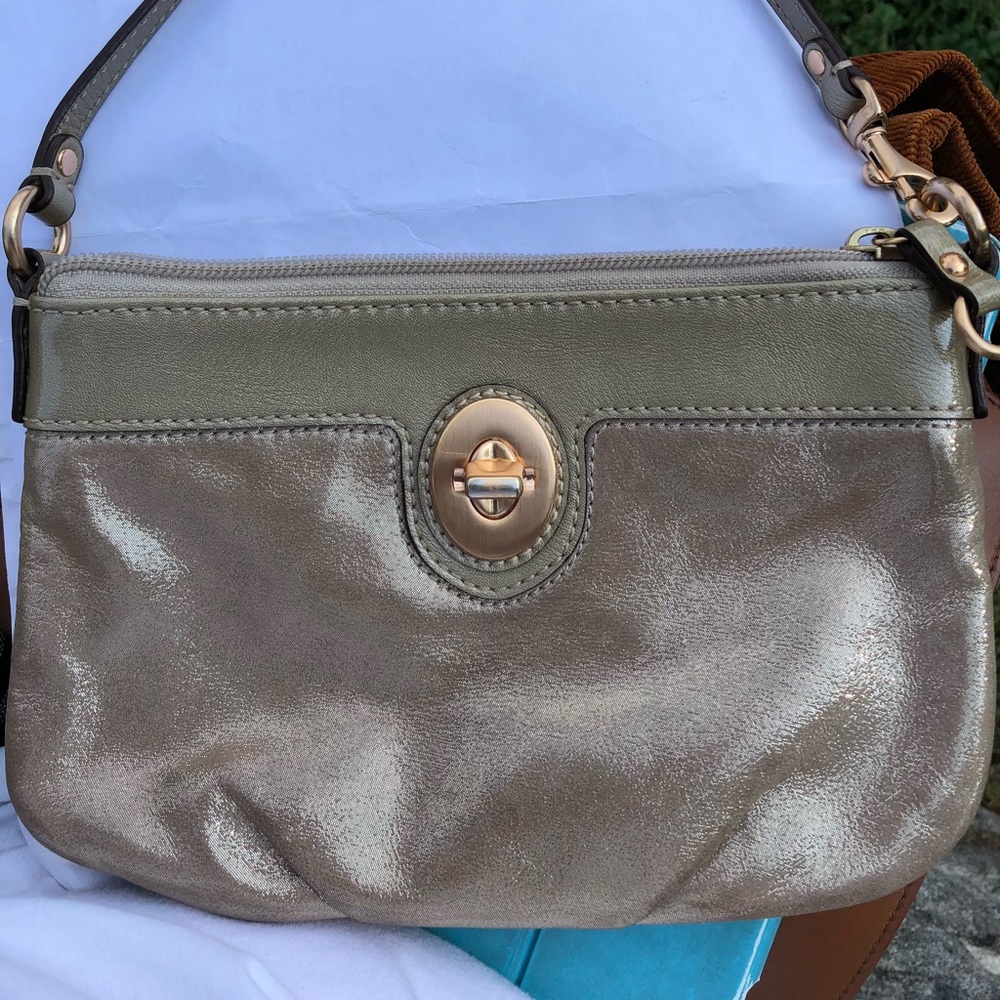 Small coach style wristlet with removeable strap